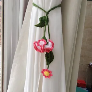 Handmade crochet flower curtain tieback, pink and white floral home decor accessory.