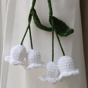 Handmade crochet lily of the valley curtain tieback, knitted flower home decor pendant detail view.