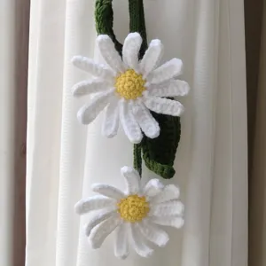 Handmade crochet white daisy curtain tieback detail, floral hanging decor, soft yarn fabric.