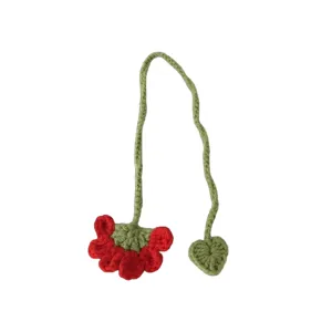 Handmade crochet flower bookmark with green stem, cute knitted page marker for reading.