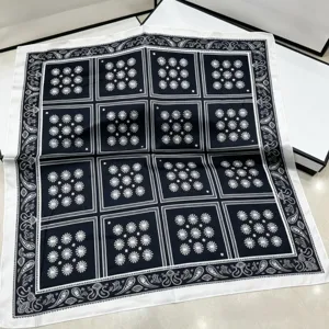 Detail view of the French vintage black and white plaid silk square scarf, elegant neck decor.