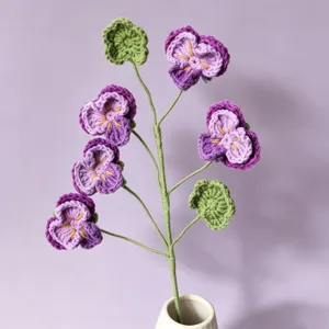 Handmade crochet pansy flower detail, exquisite knitted floral decor for home interior.