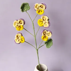 Handmade crochet pansy flower bouquet detail, exquisite wool knit home decor display.