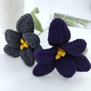 Handmade crochet yarn tulip flower detail, exquisite knitted eternal floral bouquet decor.