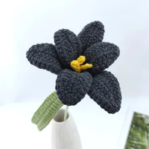 Handmade crochet dark grey tulip flower detail shot, perfect knitted yarn floral decor gift.