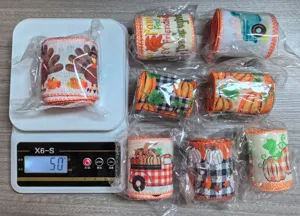 Detailed view of Thanksgiving autumn harvest themed ribbons, featuring pumpkins and turkeys.