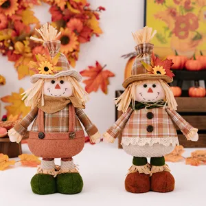 Thanksgiving harvest scarecrow doll with sunflower and maple leaf hat for autumn home decor.