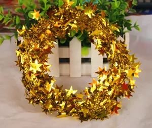 Gold Christmas tinsel garland with star shapes, perfect for holiday tree decoration and party setup.