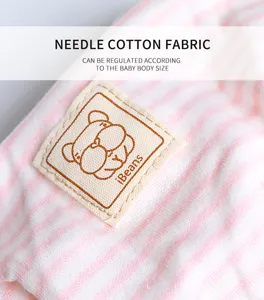 Detail view of pink striped needle cotton fabric and cute label for pet sanitary pants.