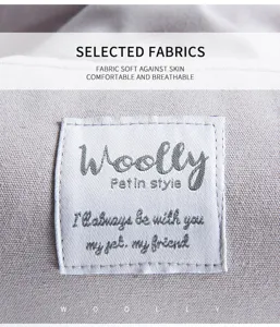 Detailed close-up view of soft breathable pet car mat fabric with branded label texture.