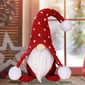 Christmas gnome plush toy with knitted red hat and white beard, cute holiday home decoration.