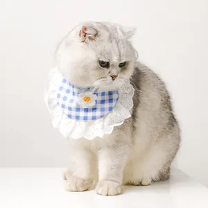 Cute cat bib with blue checkered design and white lace ruffle for pets, stylish pet collar.