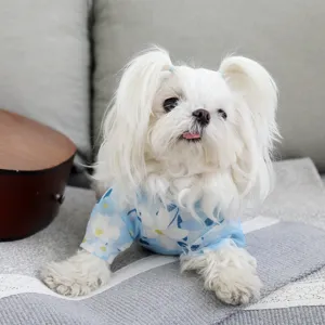Detailed closeup of breathable mesh cooling pet vest with blue floral pattern for summer days.