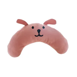 Pink crescent dog pillow, cute cartoon pet chin rest and comfortable sleeping cushion.