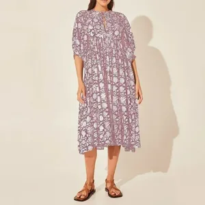 Detailed view of a purple floral V-neck midi dress with puff sleeves and tie string.