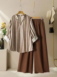Women casual two-piece set featuring striped V-neck blouse and pleated wide leg pants.