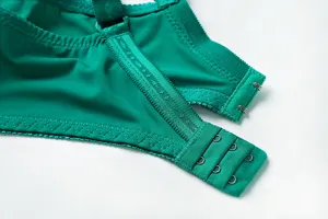 Plus size green lace bra back closure detail, comfortable and soft fabric texture.