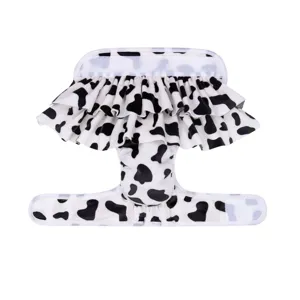Detail view of cute cow print pet sanitary pants with ruffles, soft and comfortable dog diaper.