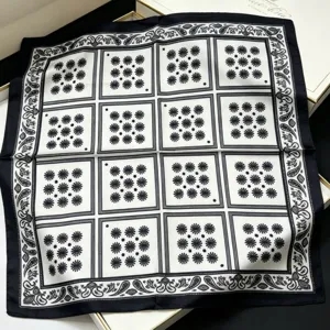 Classic black and white silk square scarf with elegant floral grid pattern and paisley border.