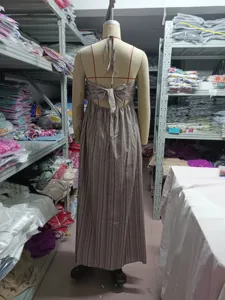 Back view of women halter neck striped long dress with elegant bow tie detail