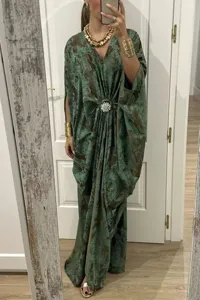Details of the elegant bohemian batwing sleeve maxi dress with stylish abstract print.