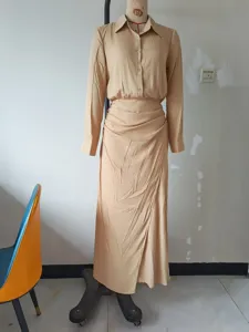 Casual beige long sleeve shirt dress with ruched irregular slit skirt for women autumn style.