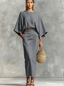Detailed view of the women linen two-piece set featuring batwing sleeve top and long skirt.