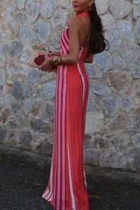 Back view of a chic colorful striped halter long dress, perfect for summer casual outings.