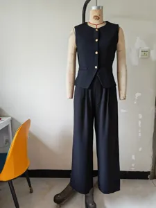 Detailed view of women elegant black vest and wide leg pants suit set in office style