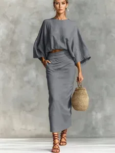 Detail view of stylish grey cotton linen two piece set featuring batwing sleeve top and skirt.