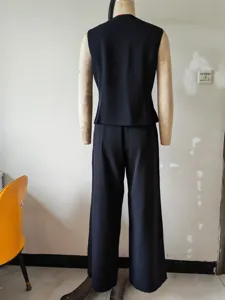 Detailed back view of a solid black sleeveless vest and matching long trousers suit.