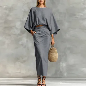 Detailed view of the elegant grey two-piece batwing crop top and long skirt outfit set.