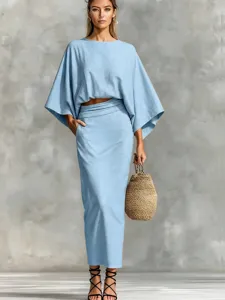 Casual cotton linen two-piece set featuring batwing sleeve top and long skirt detail.