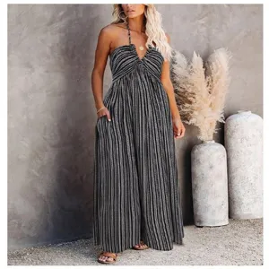 Women's black and white striped halter jumpsuit with deep V-neck and convenient side pockets.