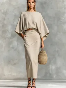Close-up detail of the breathable linen two-piece set, highlighting batwing sleeves and soft texture.