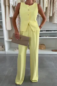 Detailed view of a chic solid sleeveless vest and wide leg trousers suit set for women.