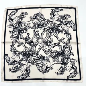 Detailed view of luxury horse print silk scarf, elegant black and white pattern fabric