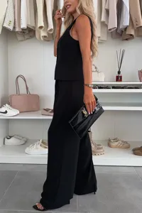 Sleeveless black vest and long pants suit set, elegant summer office outfit with button details.