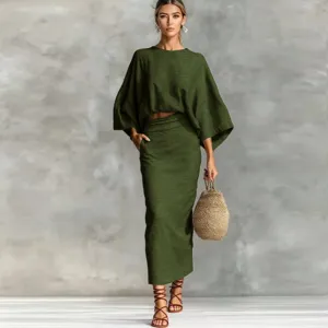Detailed view of the green linen two-piece set, featuring batwing sleeves and long skirt.