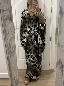 Stylish batwing sleeve maxi dress with unique animal print, chic rhinestone brooch, perfect for summer.