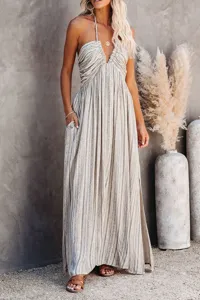 Stunning striped halter maxi dress with pockets and adjustable straps for women.