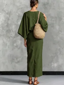 Detail view of the green batwing sleeve top and long skirt set, showing elegant back silhouette.