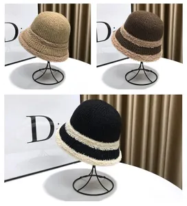 Knitted bucket hat detail showing knitted texture and plush trim, autumn winter warm hat display.