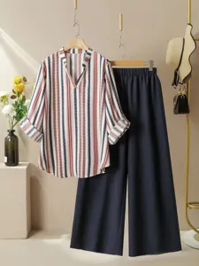 Stylish striped blouse and wide-leg pants set detail shot, casual summer fashion style.