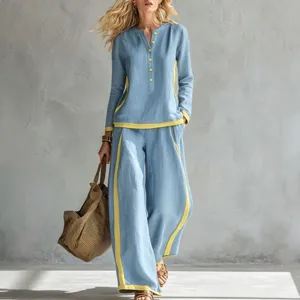 Elegante conjunto de mujer con top de manga larga y pantalón ancho detalles contrastantes.