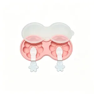 Silicone ice cream mold detail showcasing the dual flower cavities and matching sticks.
