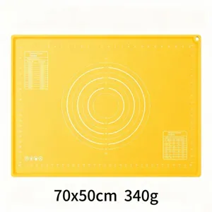 Silicone kneading mat detail showing precise measurement scales and temperature conversion chart.
