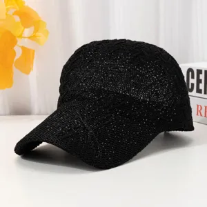 Black mesh baseball cap detail showing breathable fabric and hollow summer sun protection.