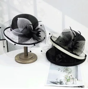 Details of the elegant black and white women mesh dome sun hat with vintage fascinator bow.
