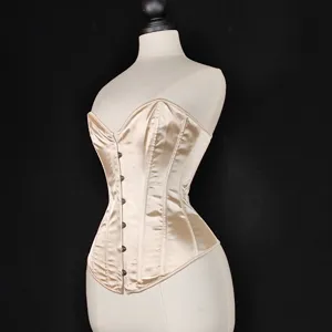 Champagne satin strapless corset top with front metal busk closures and boned waist shaping design.